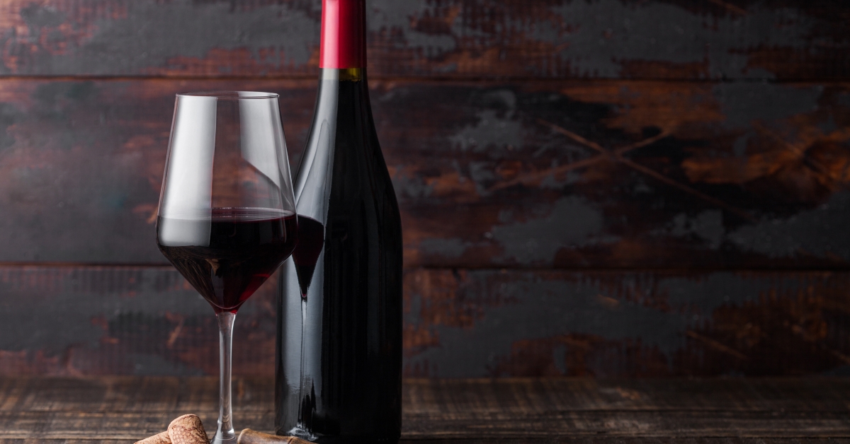 elegant glass and bottle of red wine