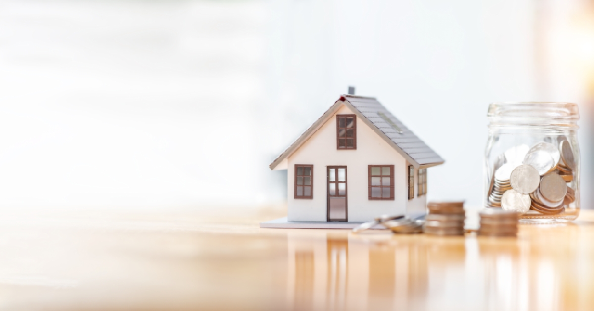 house model and money coins saving concept 