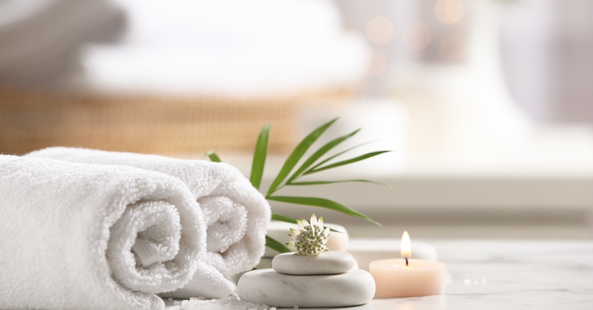 spa stones on white marble table 