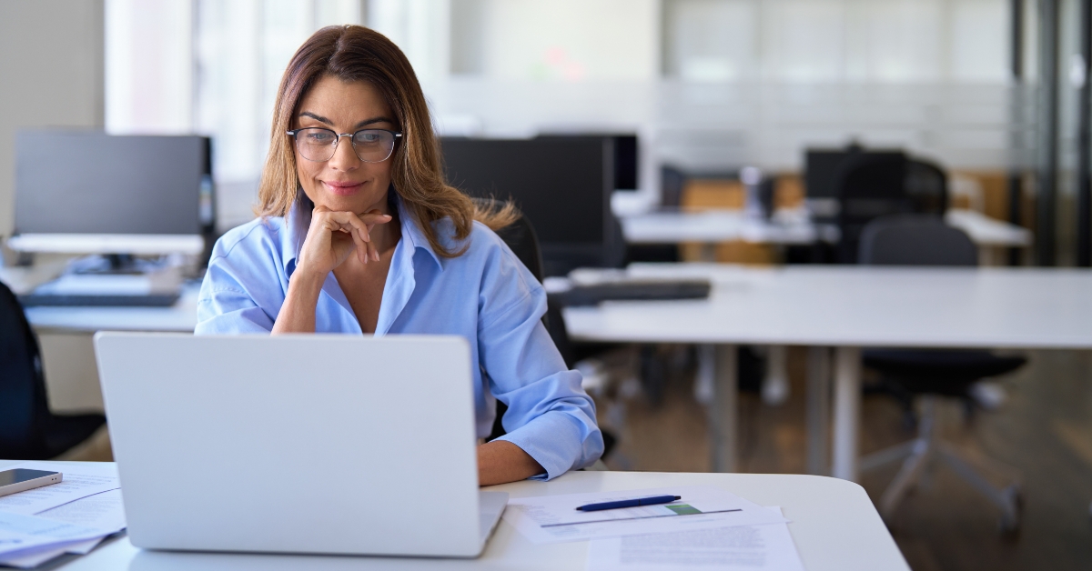 employee worker looking at laptop at workplace