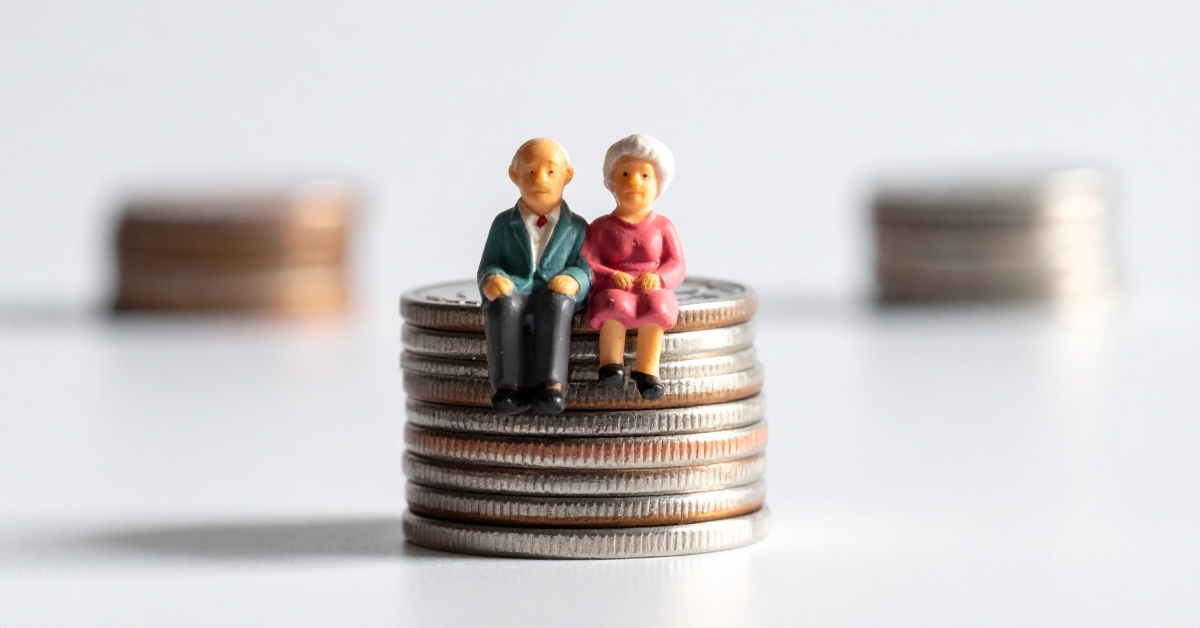 A miniature elderly couple sitting atop