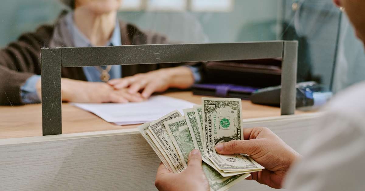 bank clerk handling financial transaction