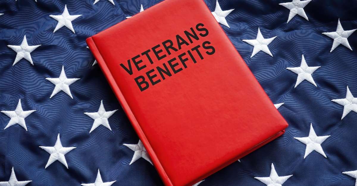 book veterans benefits on a big flag
