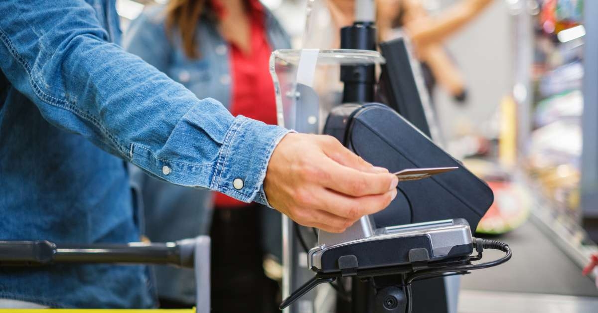 paying with a smartphone in a grocery