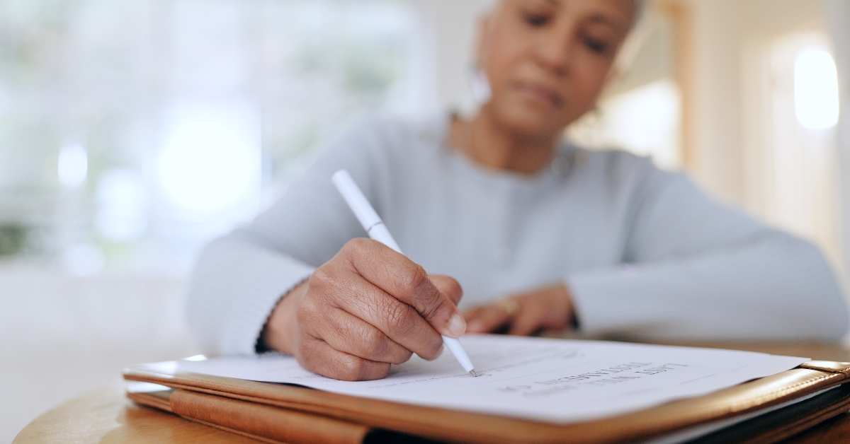 senior woman sign and writing with documents
