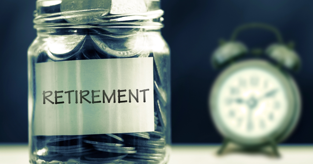 glass jar with alarm clock for time to retirement