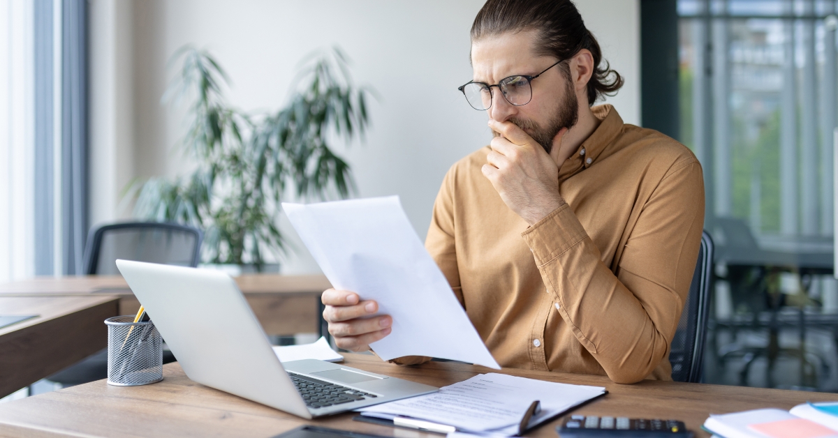 A focused professional reviews documents