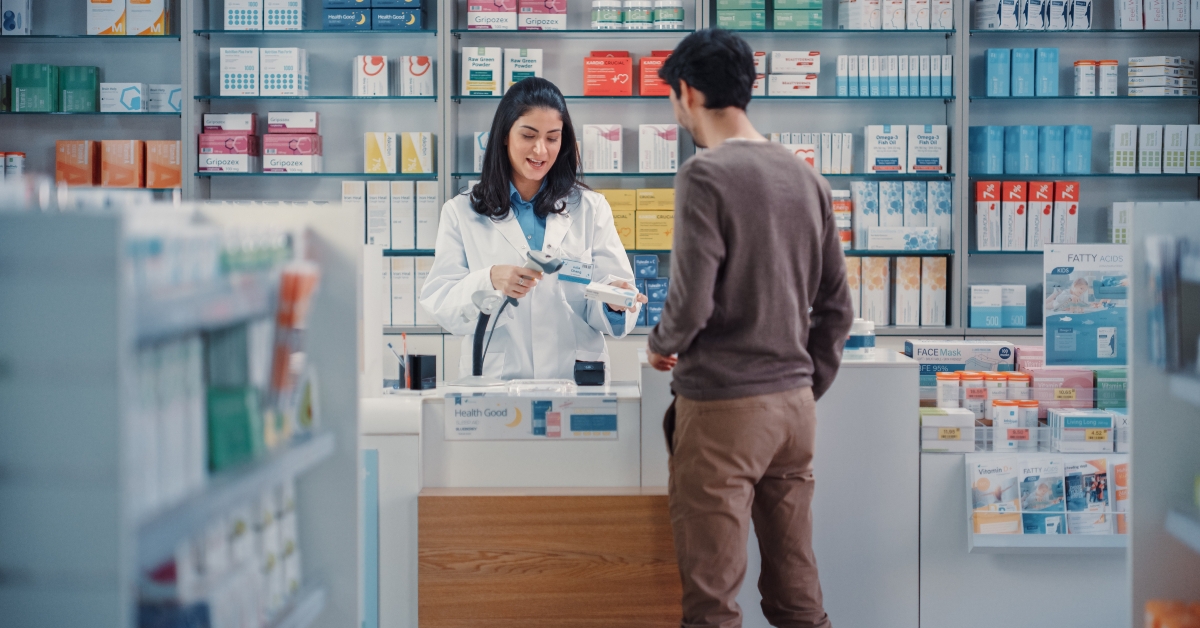 female pharmacist scans barcode