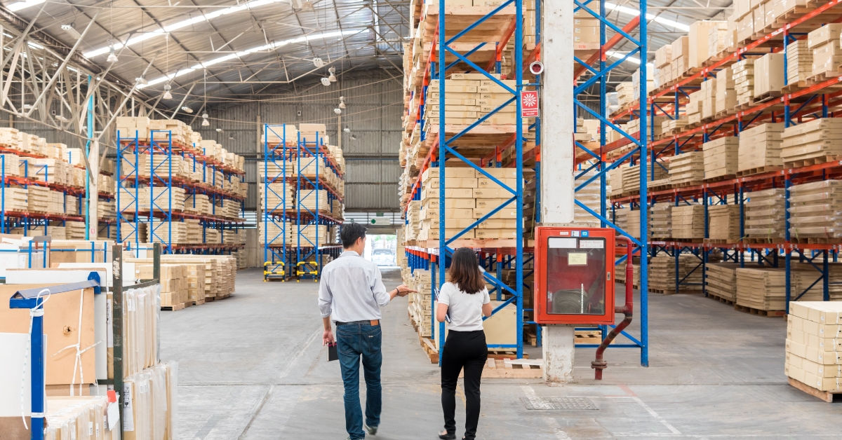 officers checks inventory in the warehouse