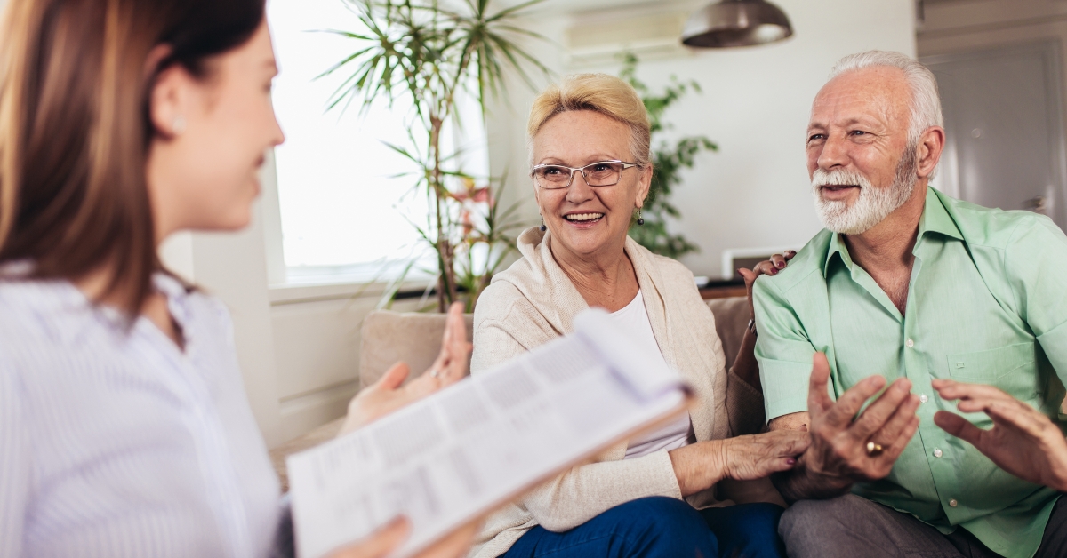 couple consulting with insurance agent