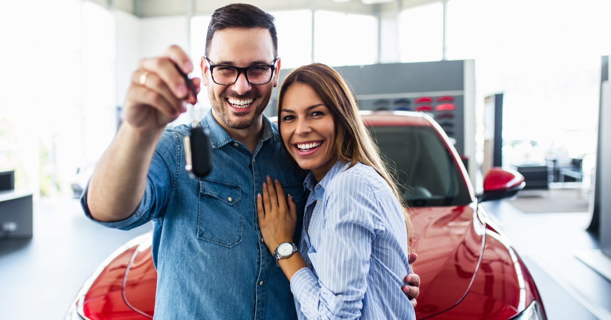  couple holding a key