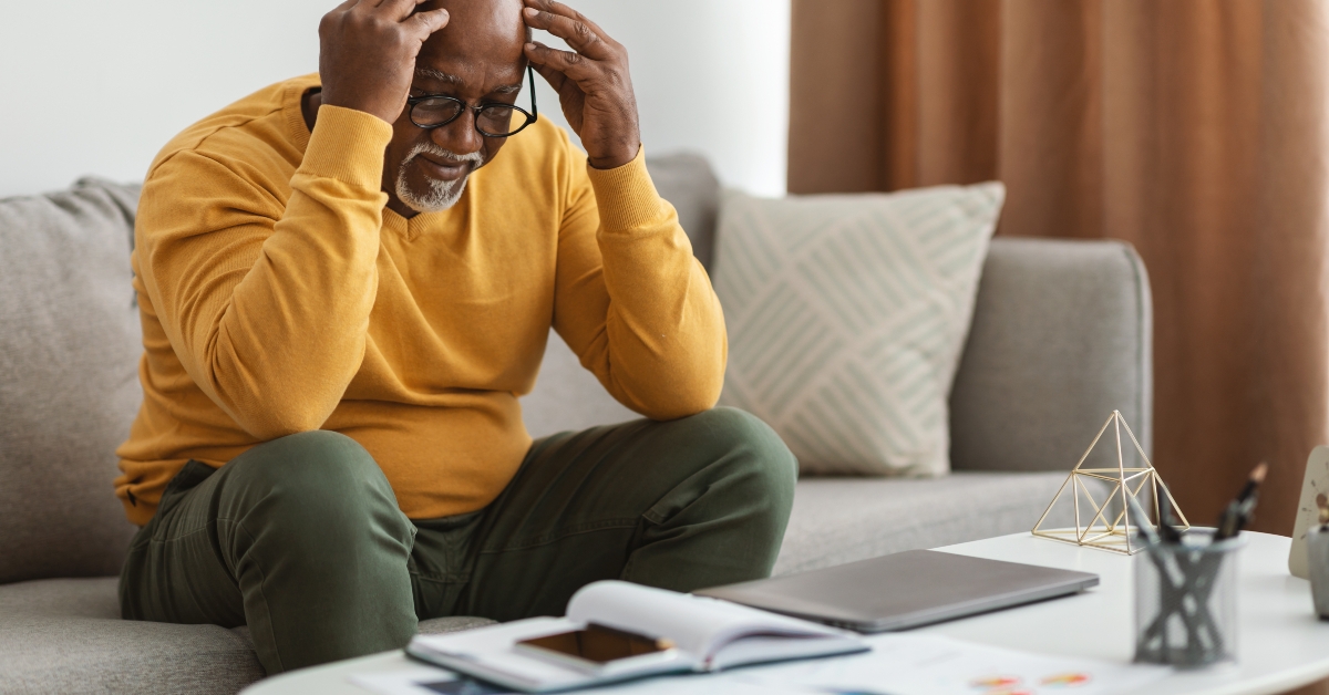 Man Touching Head Having Problem At Home