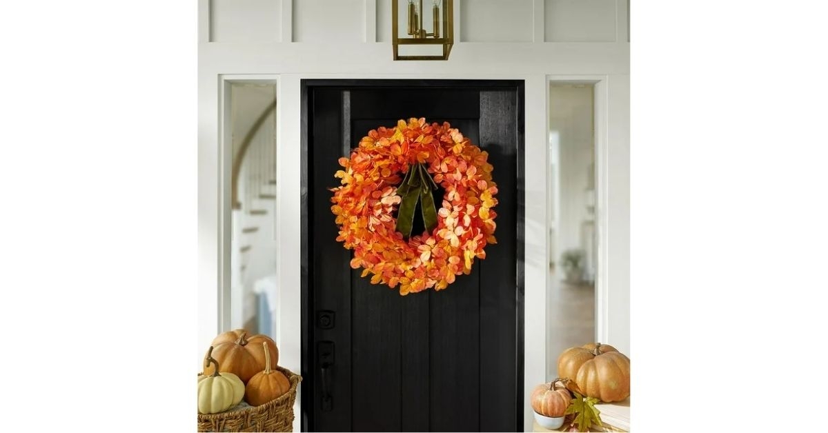members mark birch leaf wreath with bow