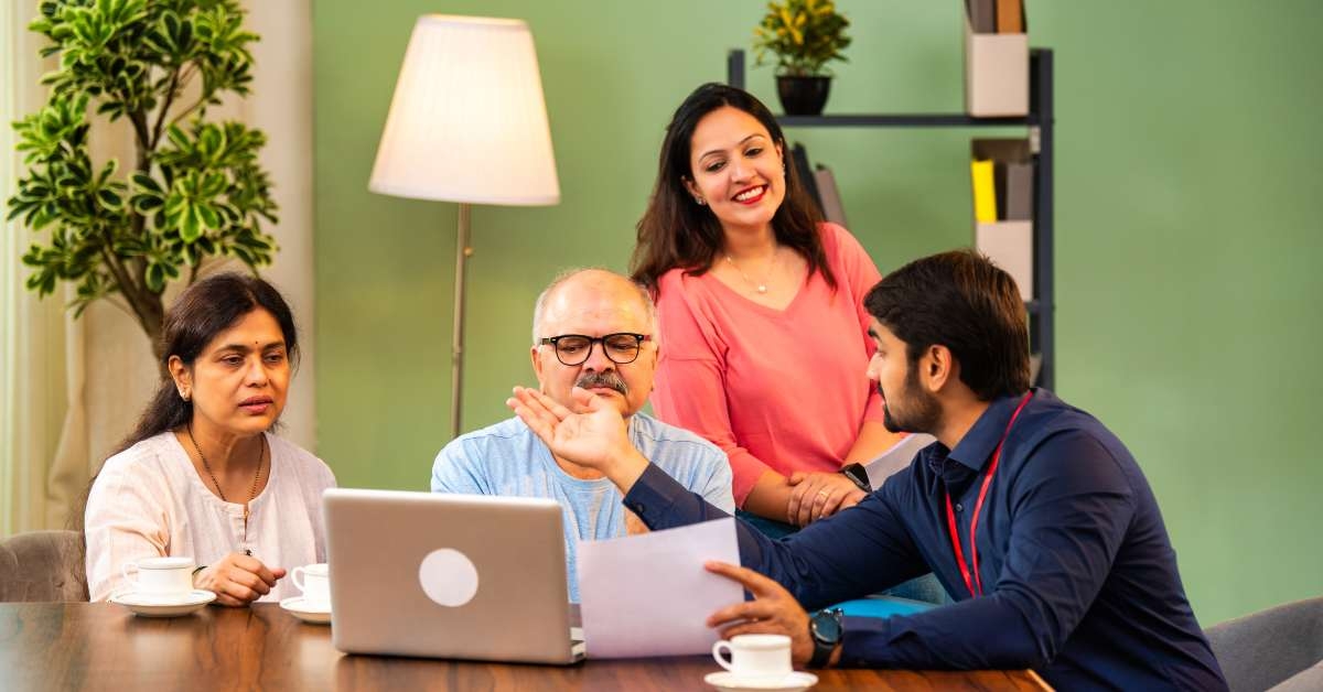 indian family consulting with financial representative