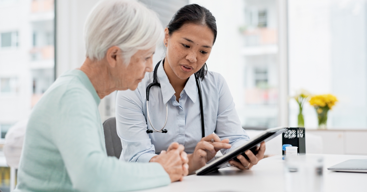 senior woman with doctor for consultation