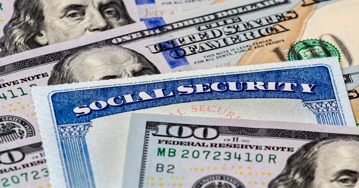 social security benefits identification card with dollar bills
