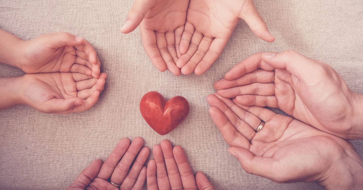 hands and red heart