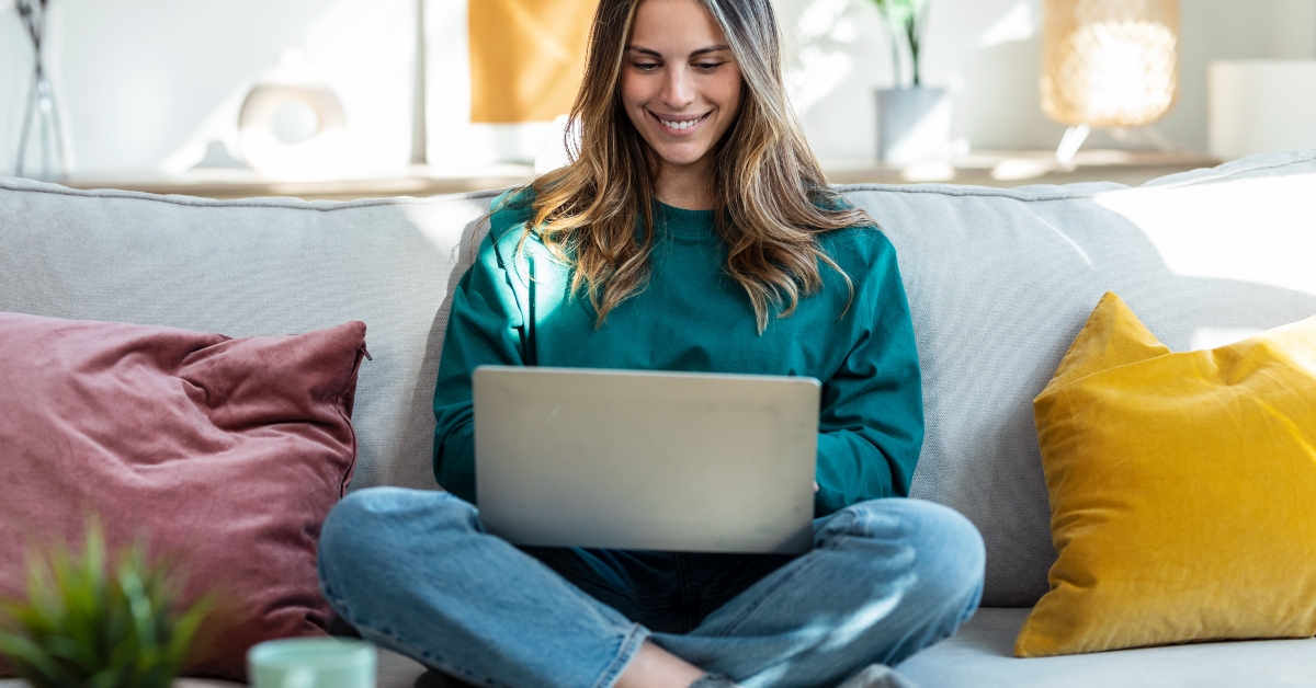 working with laptop while sitting on couch