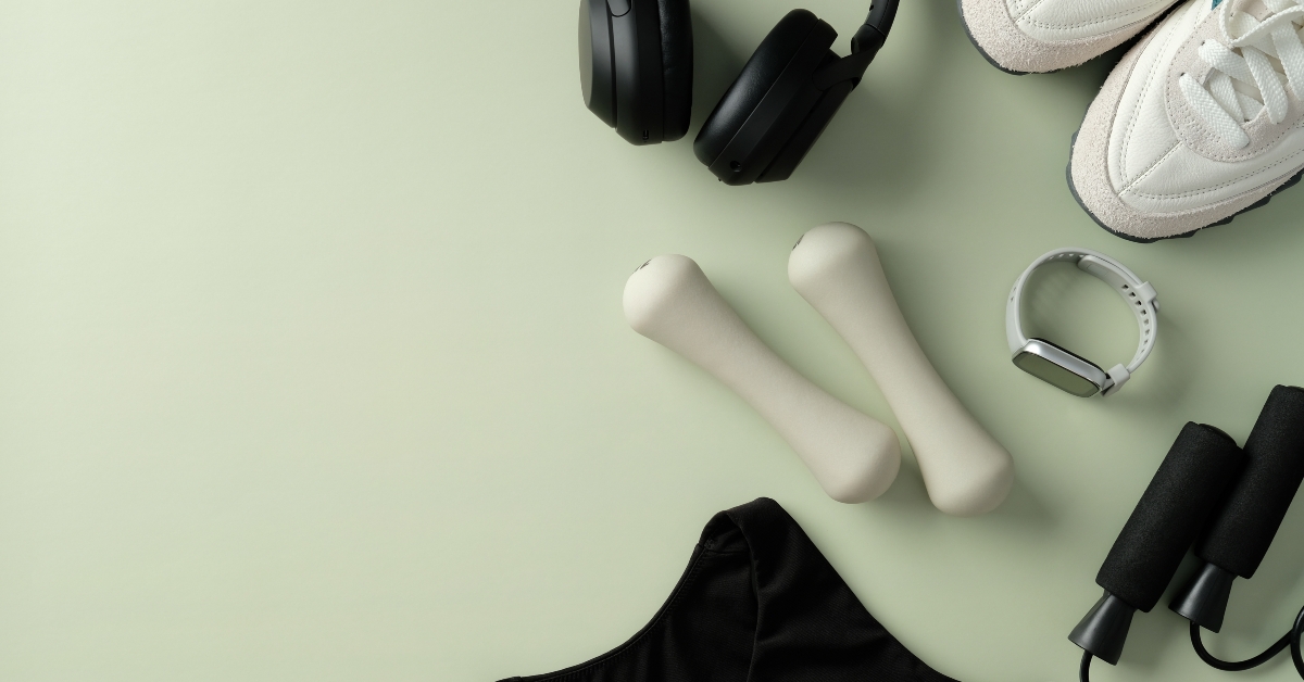 Fitness equipment on light green background