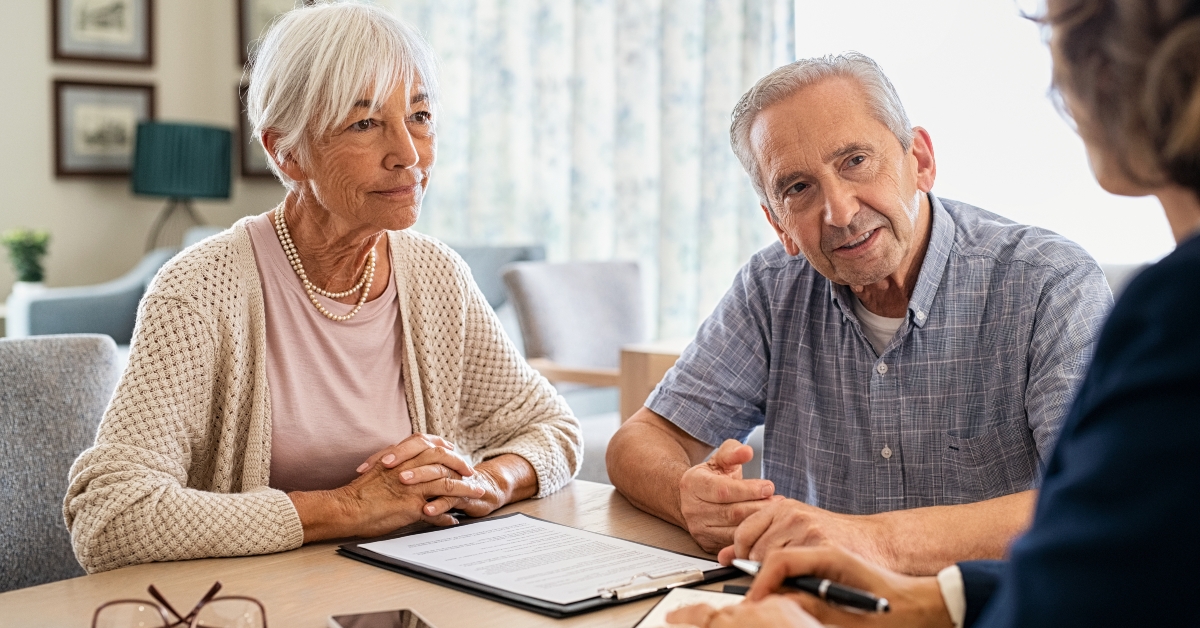 senior couple consulting with financial advisor