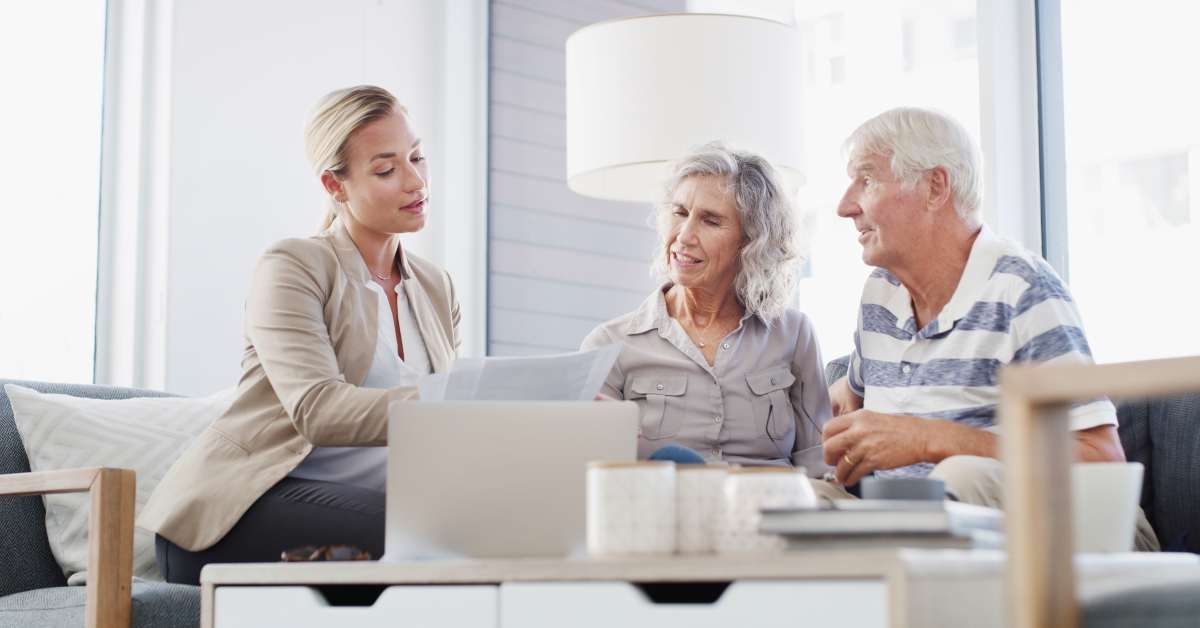 senior couple discussing retirement plan with financial advisor