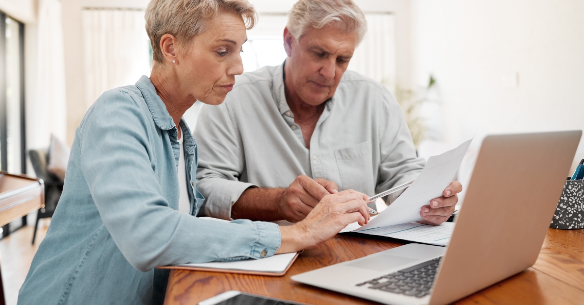 senior couple reviewing documents