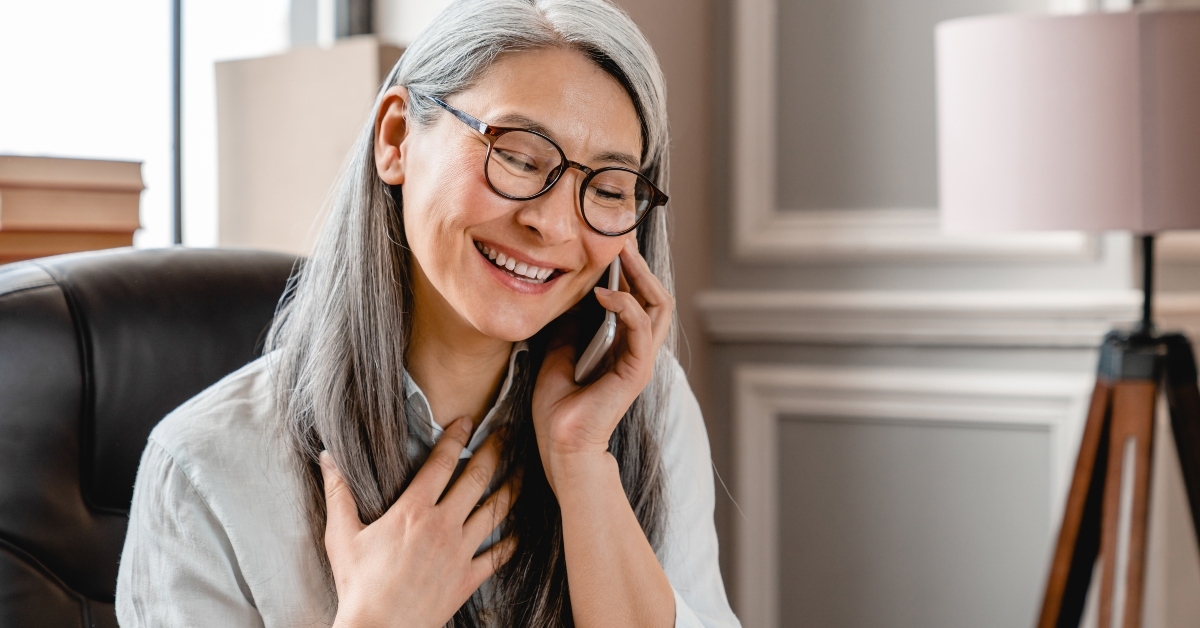 woman talking on phone at the office desk