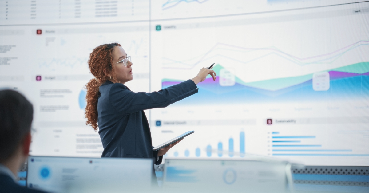 female data scientist reviewing reports