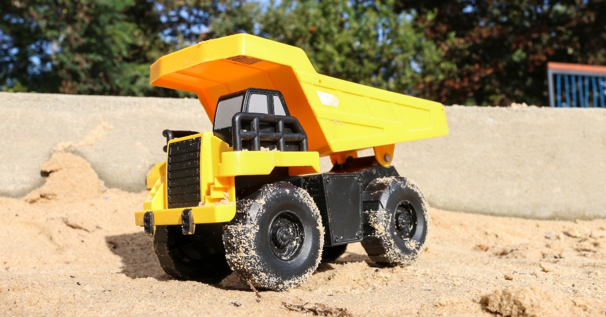 toy tonka trunk in a sandpit
