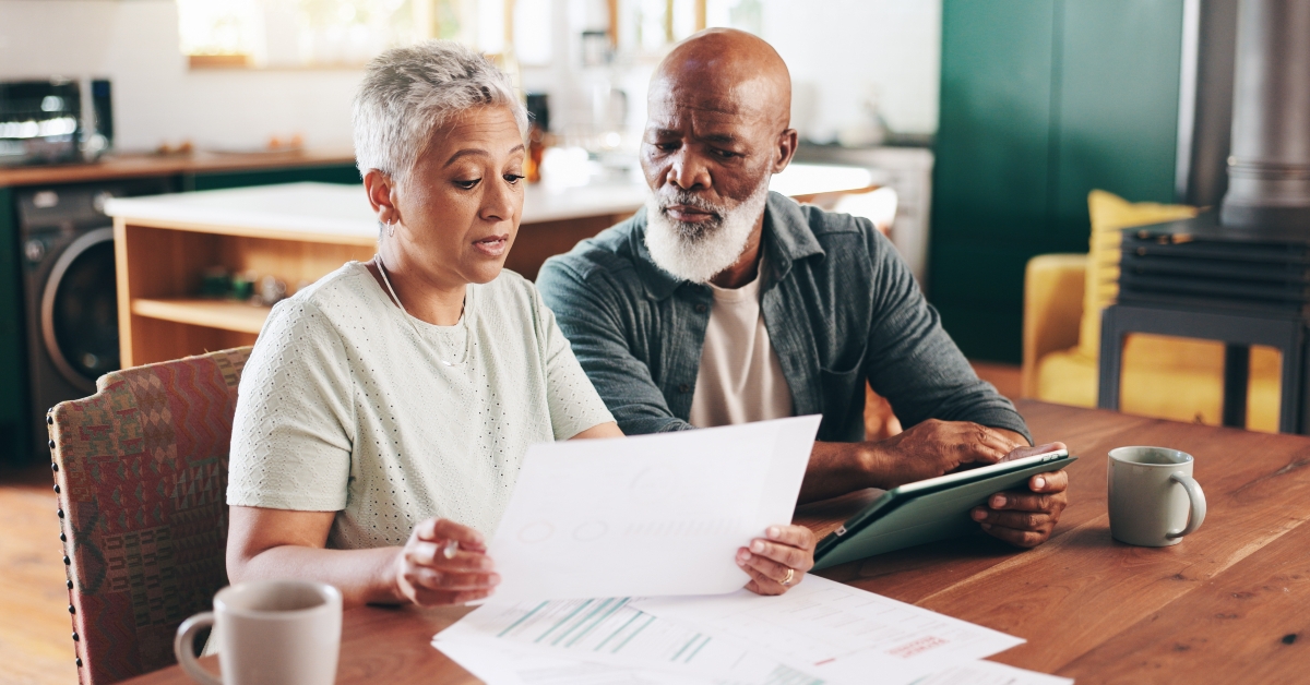 couple planning expenses at home