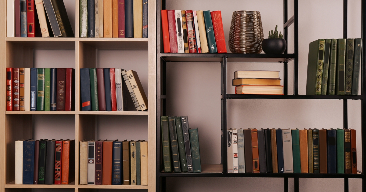 different books on shelves in home library