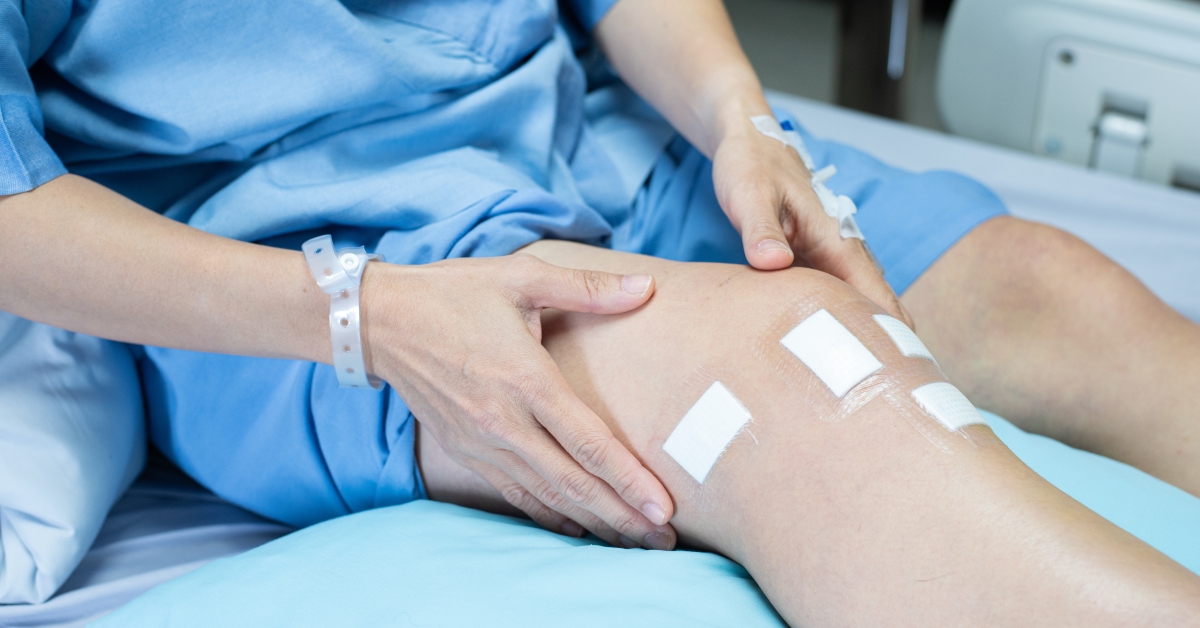 patient lying on bed in ward