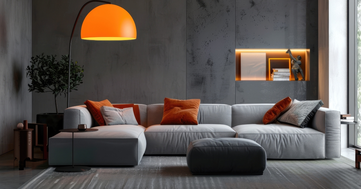 Orange lamp over gray sofa in contemporary interior