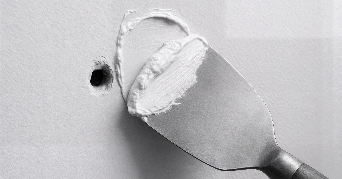 wall being repaired with spackling paste