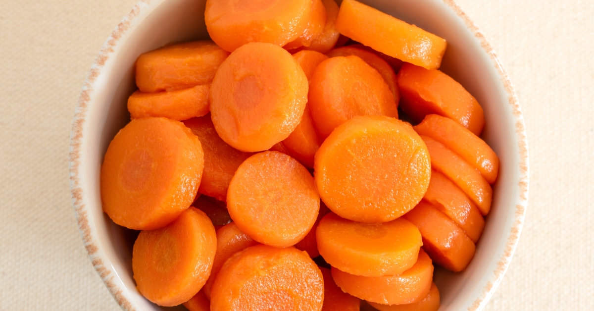 ooked Sliced Orange Carrots in a Bowl
