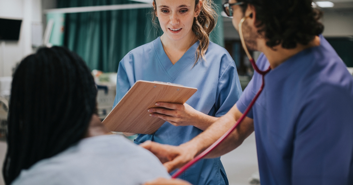 young male physician examining a patient