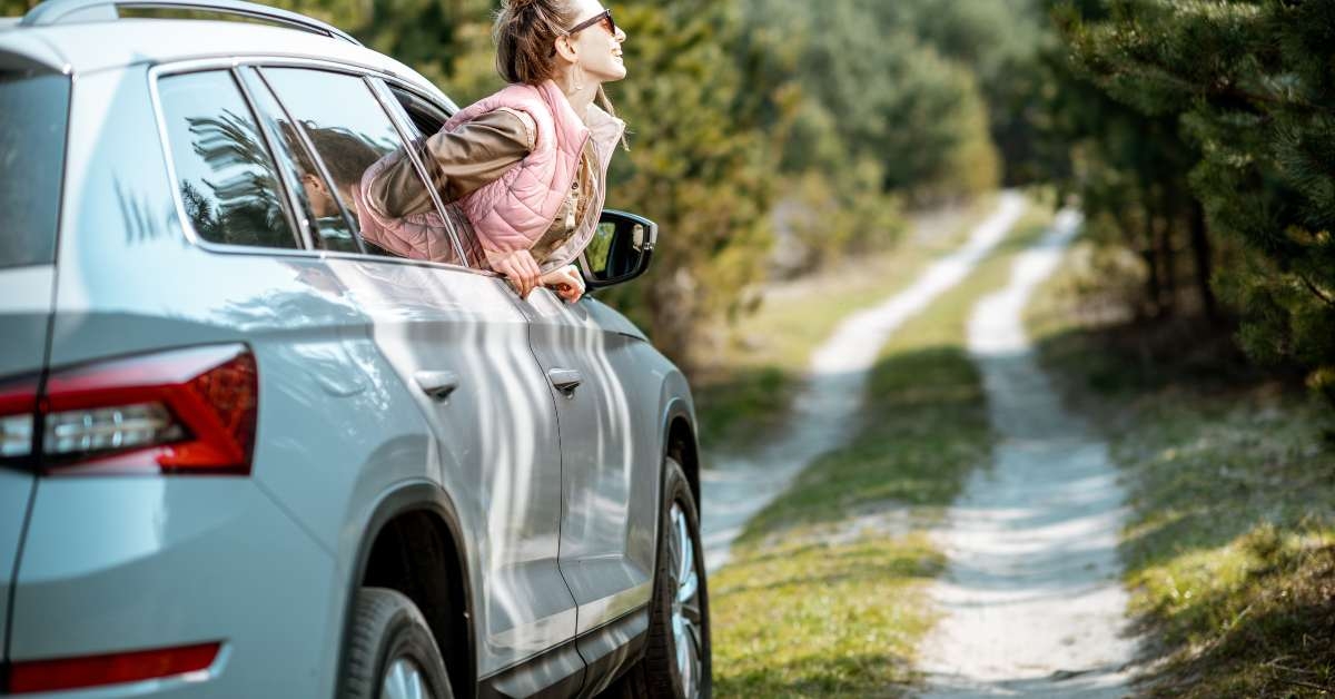 woman looking out the car window