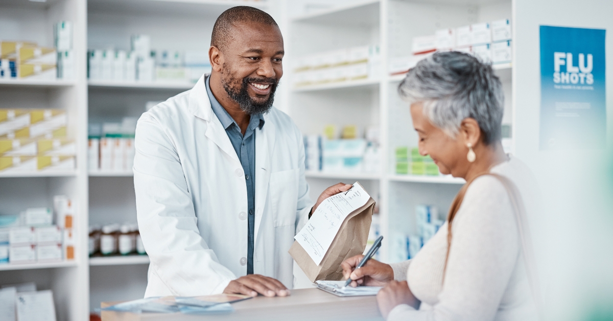 pharmacist and woman at counter 