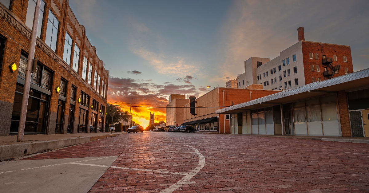 Sun setting on a old brick street in downtown