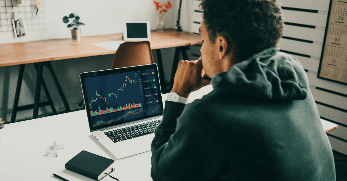 Man looking at investment info