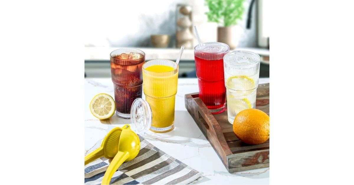 glass cups with lids and straw