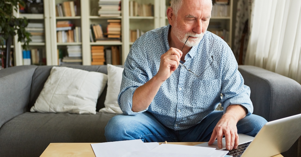 senior man working on documents