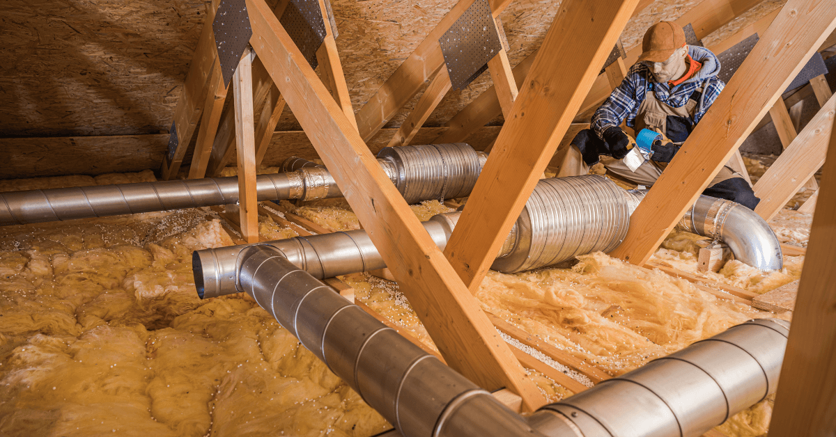 Technician working on hvac ducts