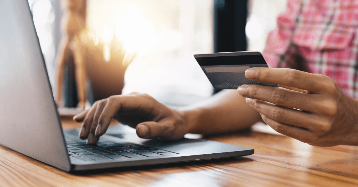 Person online shopping using rewards credit card
