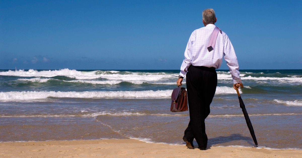man looking gazing in thought out to sea