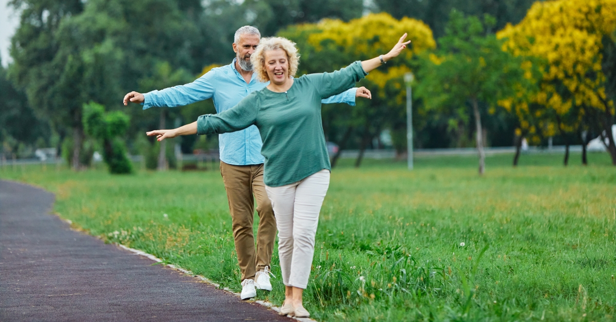 couple having fun walking and balancing