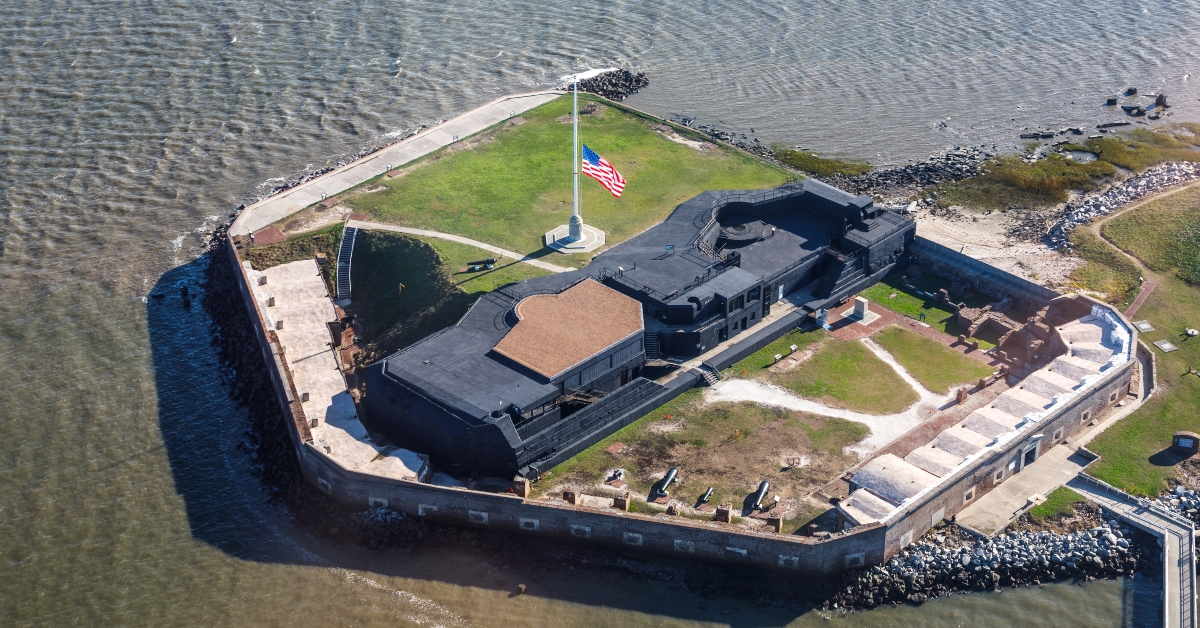 fort sumter with flag at half staff
