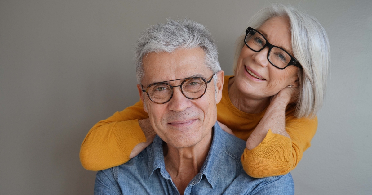 senior couple wearing glasses