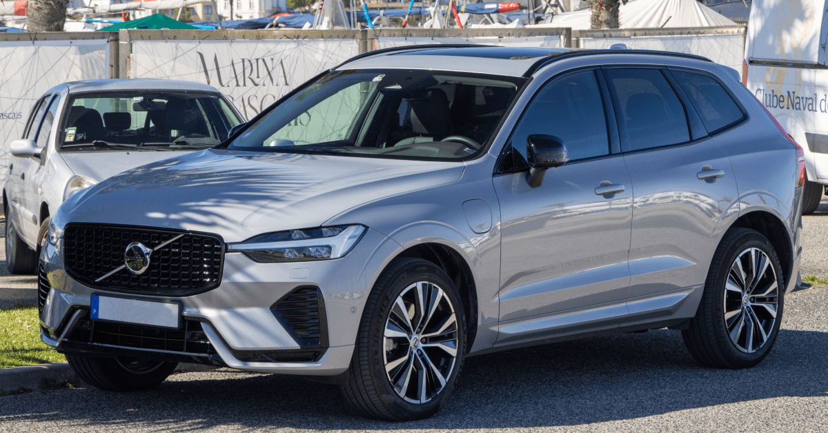 volvo xc60 recharge plug in hybrid suv parked in city 