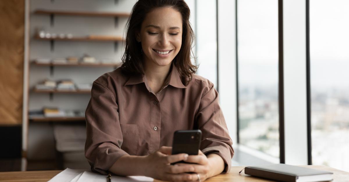 female employee reading text message